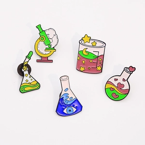 5-piece science lab enamel pin set with microscope, beakers and flasks on white background