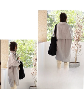 Detail of vintage canvas tote bag paired with a long-sleeved side-slit shirt and trousers