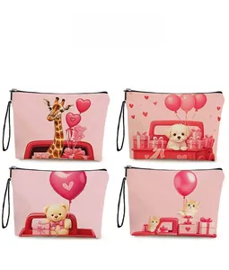 Detail view of four pink canvas makeup bags with cute animal prints and black zippers