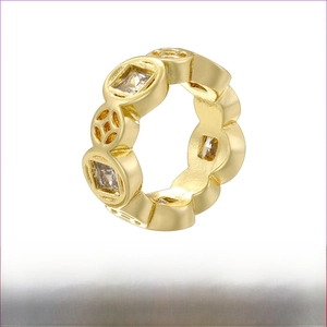 Macro shot of gold-plated brass honeycomb bead with hollow carvings and clear crystal inlay