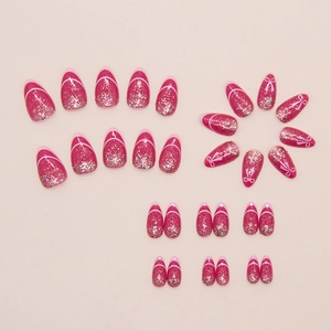 Close-up of sparkling rose pink press-on nails with glitter and bow designs