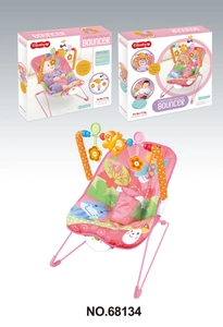 Close-up of pink baby bouncer with hanging toy bar and cartoon print fabric seat
