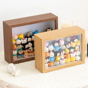 Detail of wooden shadow box frame with glass front for miniature figure collection