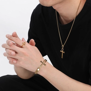 Golden Ankh jewelry set featuring a necklace, bracelet and ring in stainless steel
