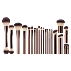 Professional 16-piece makeup brush set with bronze metallic handles on white background