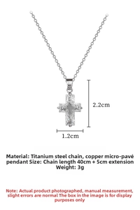 Detail of silver-tone titanium cross pendant with clear micro-pave cubic zirconia stones