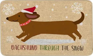 Close-up of a festive dachshund Christmas doormat with non-slip texture and snow motifs