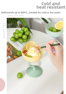 Detail of colorful glass dessert cups with twisted stems and a glass mixing spoon