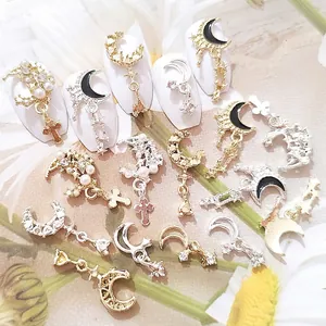 Golden crescent moon and star nail charms with black enamel and pearls for luxury nail art