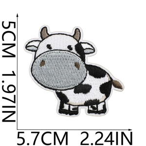 Detailed view of cartoon cow embroidery patch showing precise size dimensions on white background
