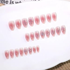 Pink gradient short almond press-on nails with colorful sequins and heart glitter
