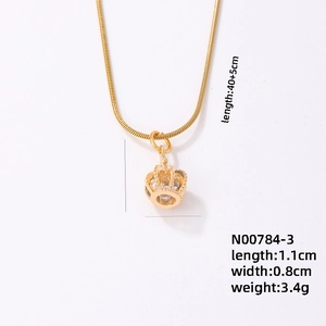 Detailed view of golden crown pendant necklace showing dimensions 1.1cm x 0.8cm and 3.4g weight