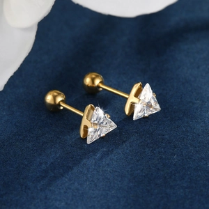 Macro view of gold stainless steel triangle zircon stud earrings with screw ball backs