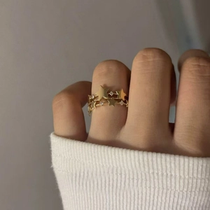 French vintage gold star open ring with sparkling zircon stones worn on finger