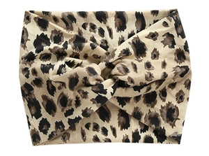 Detail of leopard print wide headband with cross-knot design for yoga and running