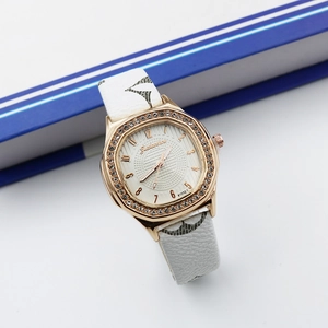 Macro detail of square rhinestone-set watch case and geometric white leather strap
