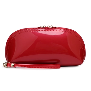 Red glossy patent leather shell-shaped makeup bag with golden zipper and wristlet strap