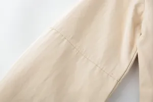 Macro shot of double-needle stitching on beige heavy canvas jacket fabric detail