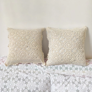 Handmade crochet cushion covers in beige with floral lace patterns and boho style