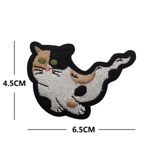 Detailed view of calico cat embroidery patch with dimensions 4.5cm by 6.5cm