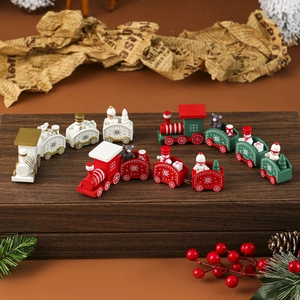 Wooden Christmas train set with three festive colors on a rustic decorative base