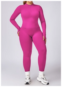 Detail of bright pink plus size yoga set with stand collar and thumbhole sleeves