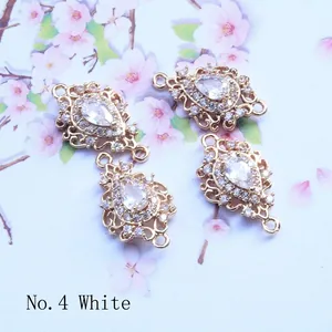 Detailed macro view of gold-plated hollow diamond pendant with white drop zircon