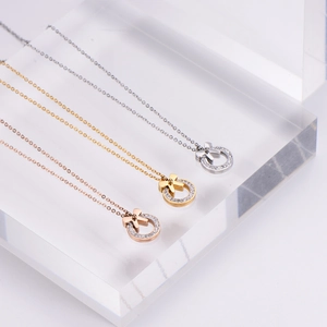 Bow knot ring pendant necklaces in silver gold and rose gold with sparkling stones