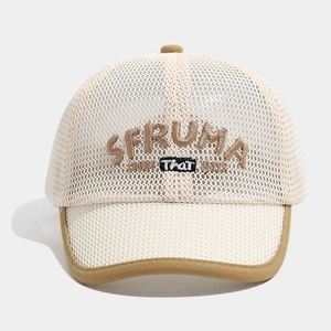 Detailed macro view of beige mesh baby baseball cap with 3D embroidery and brown brim