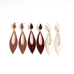 Three pairs of retro drop earrings in brown, red, and cream white with hollow design