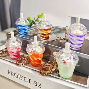 Set of seven colorful miniature sundae ice cream keychain charms with cream toppings