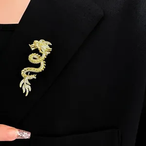 Exquisite gold-plated dragon brooch with micro-pave diamonds on a black suit lapel
