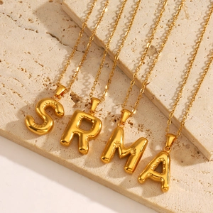 Golden puffy balloon style initial letter necklace made of premium stainless steel