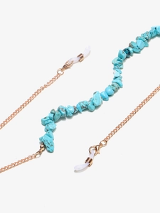 Detail view of turquoise stone beads and gold chain for glasses with silicone loops