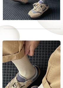 Detail view of khaki suede leisure sneakers with lace-up design and beige ribbed socks