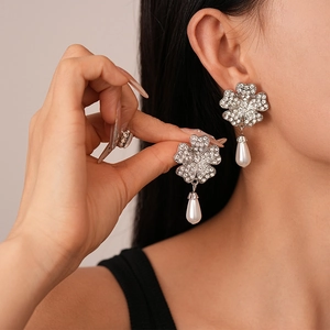 Elegant silver flower earrings with sparkling rhinestones and drop pearl pendants