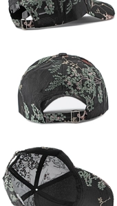 Detail of floral embroidery on black baseball cap with adjustable silver buckle and mesh