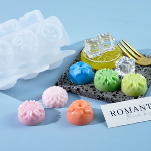 Macro detail of a 15-cavity flower silicone mold with various colorful floral desserts