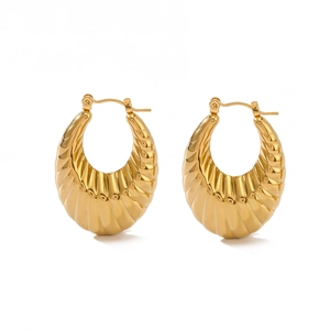 Thick gold-plated twisted croissant hoop earrings with a spiral texture design