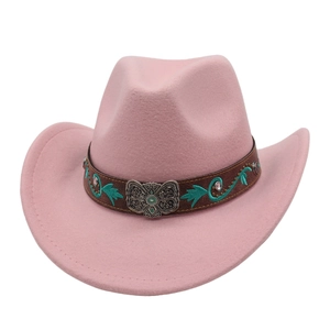 Detail of pink felt cowboy hat with embroidered brown band and metal butterfly buckle