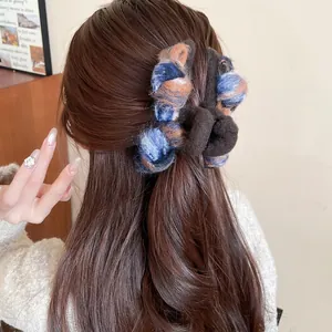 Furry oversized woven shark hair clip for women in blue and brown autumn colors