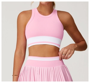 Detail of pink ribbed seamless yoga top and pleated skirt with striped elastic band