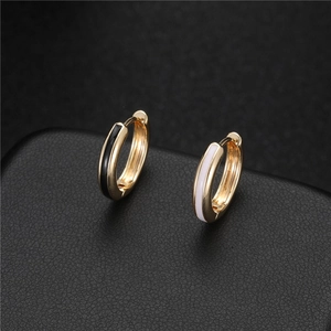 Elegant 14K gold-plated hoop earrings with black and white enamel stripes on leather
