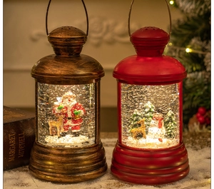 Close-up of vintage bronze and red Christmas water lanterns with Santa and snowman scenes