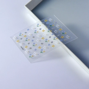 3D embossed nail stickers featuring blue and yellow flowers, butterflies, and Hello Dream text