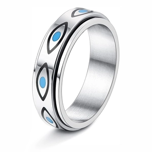 Detail shot of spinning Eye of Horus band ring with blue enamel on silver stainless steel