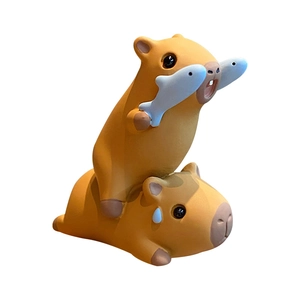 Creative stackable capybara resin figurines with fish and teardrop details on white backdrop