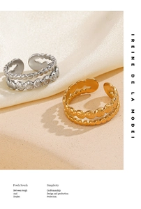 Detail of double-layer textured rings with beaded and hammered finish in gold and silver