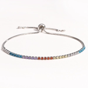 Detailed view of rainbow rhinestone tennis bracelet with adjustable sliding toggle clasp