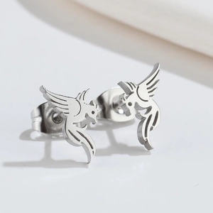 Detailed close-up of bird shaped silver stud earrings with polished metallic finish